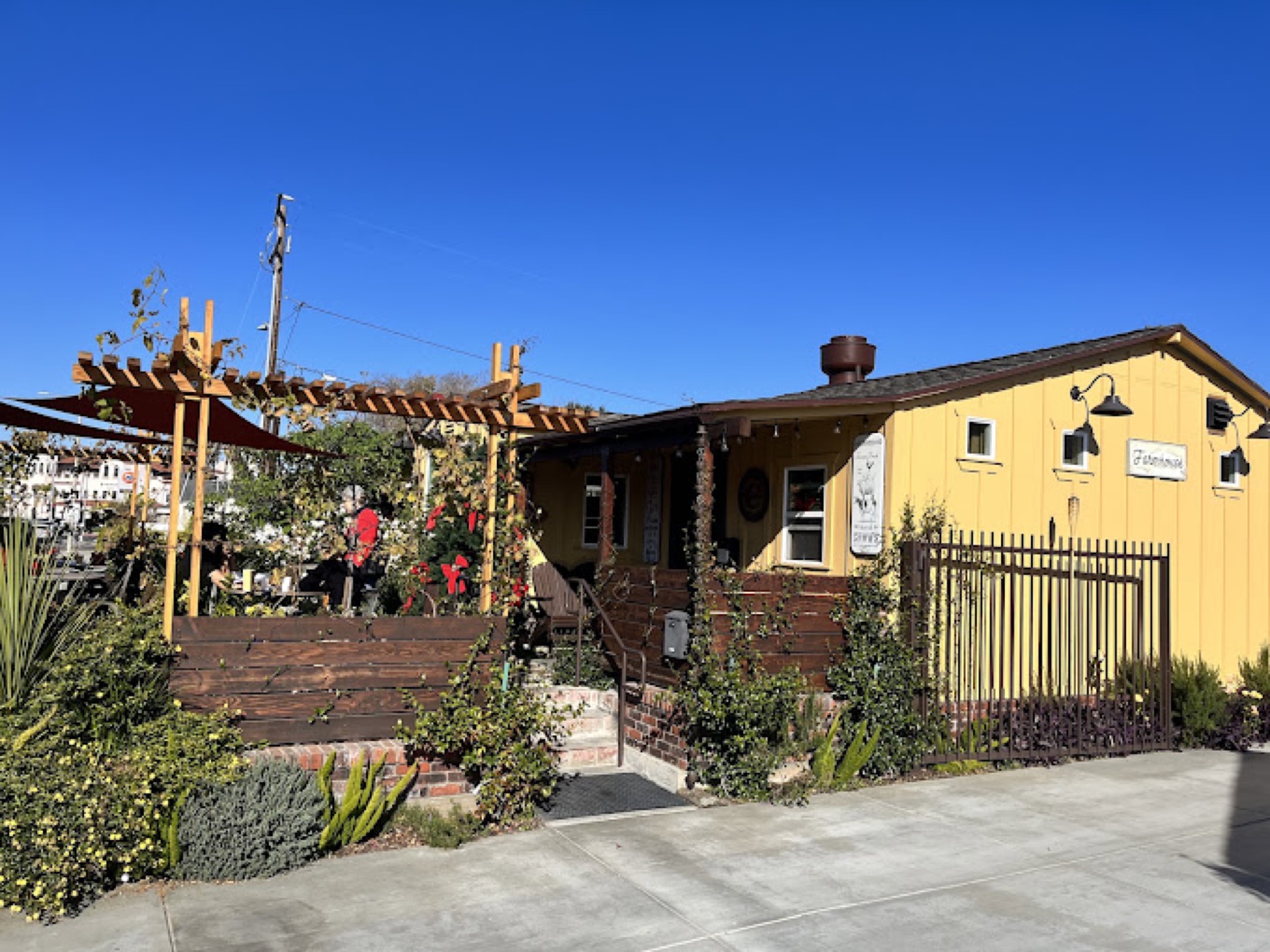 Crocker's mustard-yellow craftsman storefront on a clear day