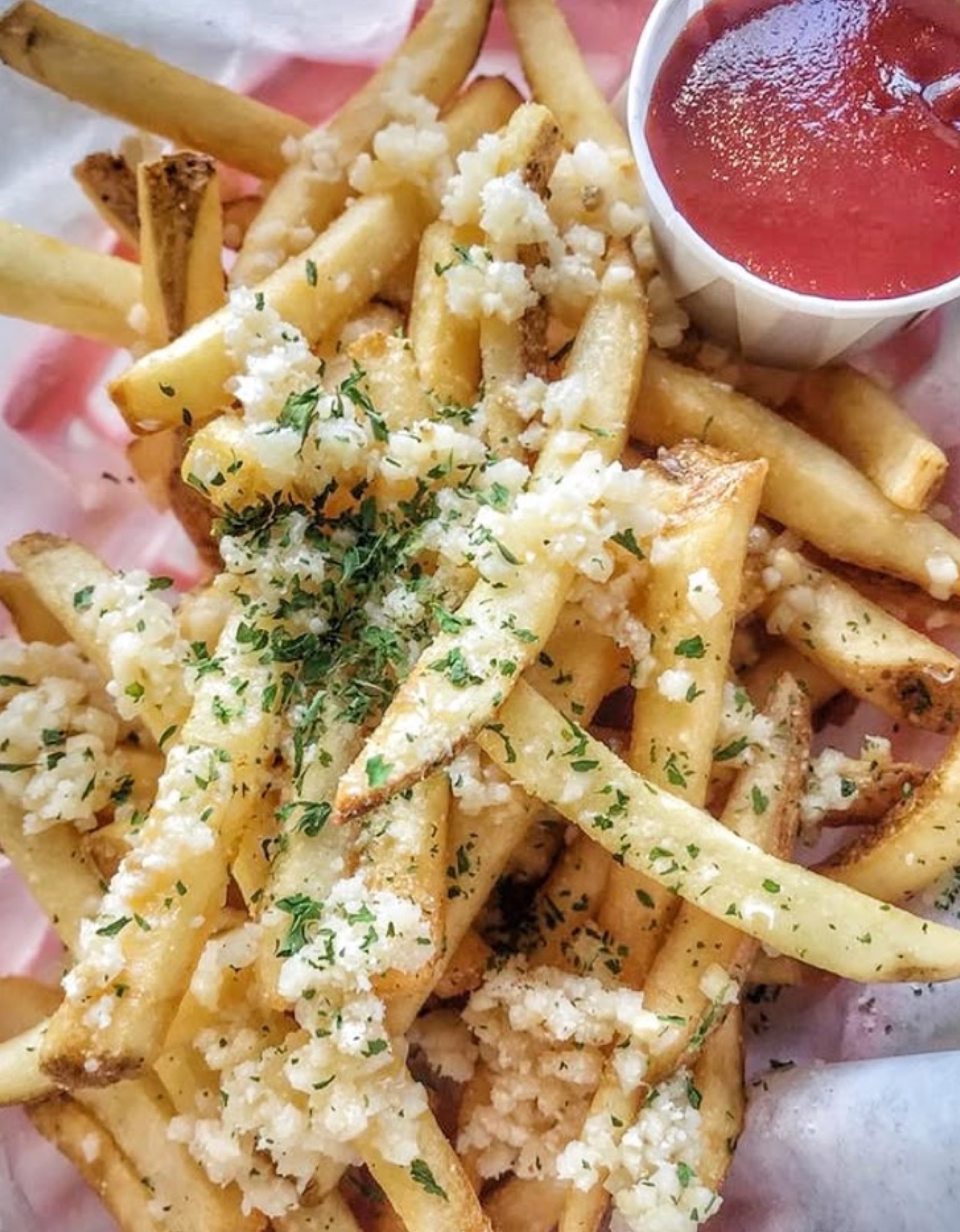 Garlic parmesan fries with a side of ketchup